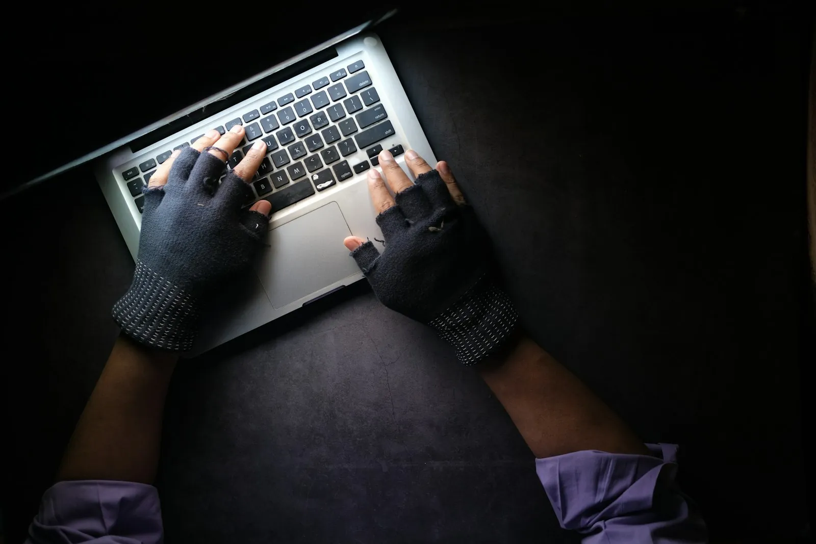 A person checking a website on a laptop